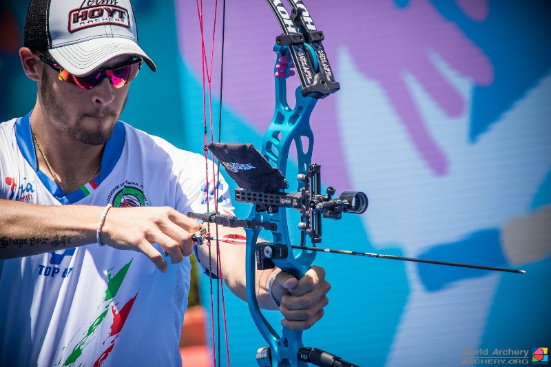 To draw a compound bow, your hands should start about at nose height, with your grip hand and the release hand extended in front of you and in line with your target. Photo Credit: World Archery